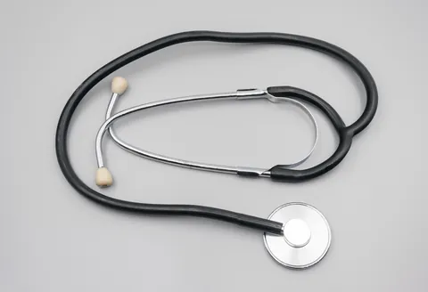 A stethoscope on a grey table